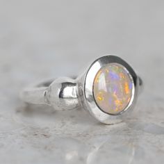 Our ancient inspired Talisman Ring has been set with a semi black opal from Lightning Ridge. Opal measures 9 x 8mm. Band width 2.5mm at back. Metal weight 11g approx. Pictured in first image with a matte finish. For a high shine finish, please leave a note at checkout.