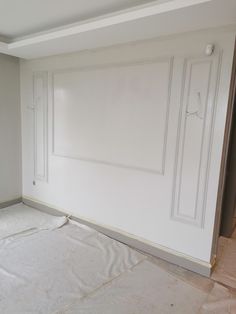 an empty room is being painted white