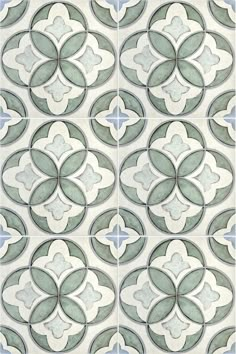 an artistic tile design in shades of green and blue, with circles on the side