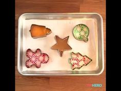 an assortment of decorated cookies in a tray