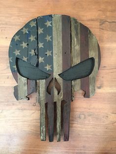 a wooden skull with an american flag painted on it