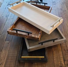 three wooden trays stacked on top of each other