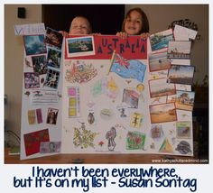 two children holding up a poster with pictures on it