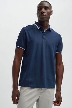 Model Height: 6'2 - Wearing Large Big & Tall: Height 6'3- Wearing XXXL Available In Black, White, Grey, Pink, Red, Navy, Neon Pink, Neon Yellow, Green, Yellow, Light Blue, and Coral Fold Down Collar 3 Button Closure Short Sleeve 100% Cotton Imported | Mens Wilson Short Sleeve Polo in Navy Blue size Small by Fashion Nova