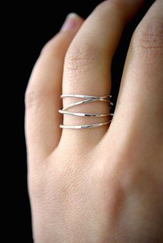 This item is made to order and will ship after 7-10 business days. That time does not include holidays, weekends or shipping time!This item is hand-crafted and made to order in Portland, OR.This is a large, four-loop version of my popular Wraparound ring! This ring makes a gorgeous, delicate and minimalist cocktail ring.I wrap a length of silver around four times and securely solder it around back. Then I lightly hammered the ring for a bright, reflective shine.The beauty of this ring lies in it Minimalist Cocktail, Silver Wire Rings, Gold Wrap Ring, Criss Cross Ring, Silver Wrap Ring, Woven Ring, Cross Ring, Sell Gold, Thumb Rings