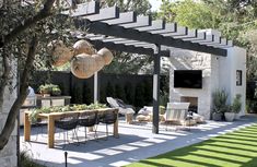 an outdoor dining area with chairs and tables