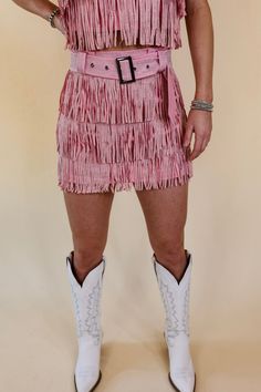 This adorable new skirt is a cowboy killer! It includes a zip up back, crystal fringe all over, shorts underneath, and a crystal belt that is removable. Pair it with boots and a bright color hat and you'll be a knockout! This skort is made of a stretchy material. This skort is made of a stretchy material. Size Suggestions - note these are suggestions only. Measurements are approximate and can vary between garments: Small: 2-4 | Waist: 30 inches Hips: 35 inches Length: 14 inches Medium: 6-8 | Wai