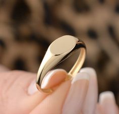 Our oval ring is made of 14k solid gold. It fits your all outfit at any time of the day with its minimalist and dainty style. Also, it can be used as a joint ring. You can enter the name, initial, date, or whatever you want on the personalization box. Your name is engraved with a special laser. ( You can see the example of a ring that is engraved with a special laser on the photos.) If you consider this gold ring as a gift for special days, it will an excellent choice for your loved ones on thei Dainty Rose Gold Oval Signet Ring, Oval Yellow Gold Ring With Smooth Finish, 14k Gold Rounded Signet Ring For Gift, Simple Design Oval Rings For Gifts, Oval Rings With Simple Design For Gifts, Oval Link Rings With Polished Finish For Gift, Minimalist 14k Gold Oval Signet Ring, Minimalist Initial Ring With Polished Finish And Oval Shape, 14k Gold Rings With Polished Oval Link