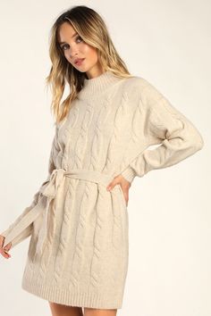 Bundling up for the season has never looked so fabulous thanks to the Lulus Warmed Up To You Cream Cable Knit Mock Neck Sweater Dress! Thick, cozy wool-blend cable knit shapes a mock neckline, long sleeves, and a relaxed bodice. The shift silhouette falls to a cute mini hem and features a tying belt that allows you to cinch the waist. Contrasting ribbed knit accents the neckline, cuffs, and hem. Fit: This garment fits true to size. Length: Mid-thigh. Size medium measures 32.5" from shoulder to h Cozy Long Sleeve Cable Knit Dress, Cozy Cable Knit Long Sleeve Dresses, Cozy Cable Knit Dresses For Fall, Fall Cable Knit Sweater Dress, Cozy Cream Sweater Dress For Fall, Cozy Cable Knit Spring Dress, Fall Cable Knit Turtleneck Sweater Dress, Fall Cable Knit Dresses, Cream Knitted Sweater Dress For Fall