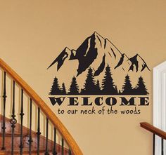 welcome to our neck of the woods wall decal with mountains and trees on it