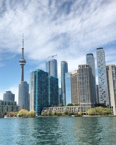 the city skyline is seen from across the water