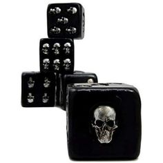 three black dices with skulls on them