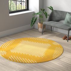 a living room with a yellow rug on the floor