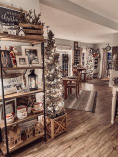 a living room filled with lots of furniture and christmas decorations on top of wooden shelves