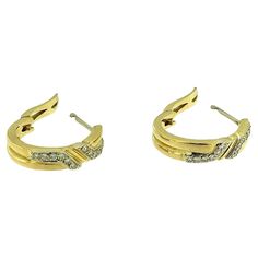 These Vintage Italian Gold Hoop Earrings are a captivating blend of classic elegance and timeless beauty. Crafted with a luxurious combination of white and yellow gold, these earrings showcase the refined craftsmanship that Italian jewelry is renowned for. Each hoop is adorned with 12 sparkling diamonds, for a total of 0.24ct. The diamonds are delicately set into the hoops, adding a subtle yet striking touch of brilliance that enhances the overall design. The mix of white and yellow gold creates Hoop Earrings With Diamonds, Earring Video, Modern Hoop Earrings, White Gold Hoop Earrings, White Gold Hoops, Italian Jewelry, Gold Diamond Earrings, Diamond Hoop Earrings, Elegant Accessories