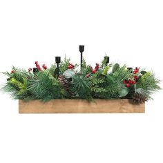 a planter filled with pine cones and greenery