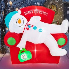 an inflatable christmas chair with a snowman on it