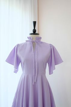 Solid Ruffled Dresses For Banquet, Solid Ruffle Dress For Banquet, Lavender Short Sleeve Formal Dresses, Spring Purple Fitted Bridesmaid Dress, Fitted Purple Midi Bridesmaid Dress, Fitted Purple Bridesmaid Midi Dress, Fitted A-line Lavender Dress, Fitted Purple Bridesmaid Dress For Spring, Purple Short Sleeve Wedding Dress