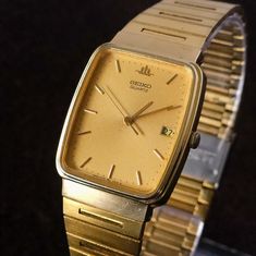 Brand: Seiko Movement: Quartz Rough Maximum Wrist Size: ~21 cm Case Size - Width x Height: ~ 27 x 30 mm - includes crown. This vintage Seiko watch, made in 1997, features a rectangular gold textured dial for a classic and timeless look. With a precise quartz movement and a 27mm x 30mm gold case, this men's watch is both functional and stylish. Its 21cm maximum band length ensures a comfortable fit for all, it can be easily adjusted via a sliding clasp mechanism so can fit most wrists. Condition: Vintage Seiko Watches, Japanese Domestic Market, Seiko Watch, Seiko Watches, Men Vintage, Gold Case, Gold Texture, Wrist Watches, Men's Watch