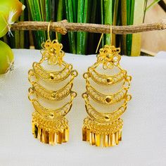 Beautiful and stunning handmade Mexican Filigree Earrings. Each piece is meticulously created out of copper wire and spun into a beautiful design. To give it the final touch artisans dipped into gold plate for it's gold color. This accessory is an important part of the traditional Tehuana outfit from Oaxaca, Mexico. Look elegant while wearing Mexico's culture with this one of a kind earrings! Approximate length: 3-3.5 in Need more than one? Ask us about our combined flat rate shipments for multi Ornate Ceremonial Drop Earrings, Ceremonial Intricate Chandelier Drop Earrings, Ceremonial Drop Earrings, Ceremonial Chandelier Drop Earrings With Intricate Design, Ceremonial Intricate Dangle Chandelier Earrings, Ceremonial Pierced Gold-plated Earrings, Ceremonial Dangle Chandelier Earrings With Intricate Design, Ceremonial Chandelier Dangle Earrings With Intricate Design, Filigree Chandelier Drop Earrings For Festivals