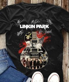 a black shirt with an image of the band linkin park on it and two pairs of jeans