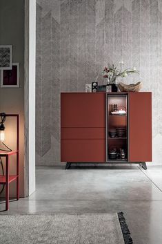 a red cabinet sitting in the middle of a room