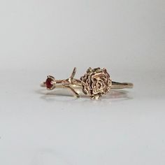 Our special collection of birth flower rings are inspired by the love of wearing something meaningful. Each birth flower is adorned with that month's birthstone. January's birth flower is Carnation and the birth stone is garnet. Materials: 14K solid gold 2mm natural garnet 1.1mm band thickness ** This item is specially made for you. Please allow 1-2 week lead time. Shipping:Domestic: Free standard shipping within the U.S.International: Free standard shipping for orders over $200 Customization:- 14k Gold Birth Flower Jewelry For Anniversary, 14k Gold Jewelry With Birth Flower For Anniversary, Heirloom Birth Flower Jewelry For Anniversary, Yellow Gold Flower Ring With Birthstone For Gift, 14k Gold Flower Ring With Birthstone For Anniversary, Rose Gold Flower Ring Stamped 14k For Anniversary, Gold Flower Ring For Anniversary - May Birthstone, 14k Rose Gold Flower Ring For Anniversary, Fine Jewelry Birthstone Flower Promise Ring