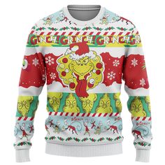 an ugly christmas sweater with the grin on it's chest and santa clauss hat