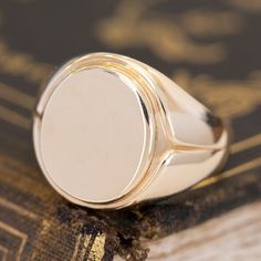 This vintage signet ring from the famed house Tiffany & Co. is big, bold, and gold - three of our favorite things here at JbyG. The 14kt gold is such a warm and buttery tone, and when worn, the ring feels like armor on the finger! The top of the ring is blank and ready to be engraved with a message or image of your choosing - or leave her blank and let your daily life leave its mark! 14kt Yellow Gold Size 9.75 & fully resizable Please see qualitative report for more information. Modern Mens Rings, Art Jewelry Earrings, Antique Watches, Gold Signet Ring, Antique Engagement, Vintage Band, Men's Rings, Vintage Yellow, Vintage Engagement Rings