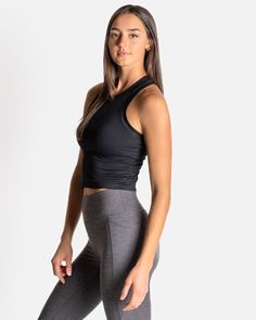 If you love our Bella Ribbed Tank, then say hello to the CROPPED Bella Ribbed Tank. Just a little extra crop for those who like a shorter length in their tank. This fabric has lots of stretch, so it will never chafe and will always keep you feeling cool, confident, and comfortable. With a racerback cut, no cups or removable shelf bra—so you can wear this tank over any workout bra you choose—it’s also incredibly versatile in a variety of activities. Versatile Black Fitted Crop Top, Black Fitted Versatile Crop Top, Versatile Medium Support Crop Top, Black Crop Top For Gym, Fitted Black Workout Top, Black Athleisure Crop Top, Black Fitted Crop Top, Fitted Black Yoga Top, Black Fitted Yoga Top