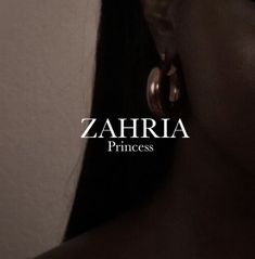 a woman with large hoop earrings on her face and the words zahira princess