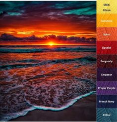 the sun is setting over the ocean with many colors