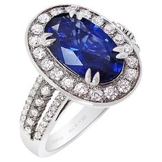 Our new platinum custom natural Ceylon sapphire ring features an oval-cut blue sapphire that measures 11.34 x 6.78 x 3.89 mm and weighs 2.37 carats. The sapphire has a GIA color grade of B 6/4, which means it has a medium-dark, moderately strong blue color with no secondary colors. It is also GIA-certified. The sapphire is set with 62 round brilliant cut diamonds weighing 0.62 carats, with VS-SI clarity and G-H color. The sapphire displays perfect tone and saturation, giving off a beautiful bright blue hue. Our master jeweler has set this stunning sapphire into a custom ring, surrounded by a halo of large brilliant-cut diamonds. Three rows of diamonds accent both sides of the ring shank, beautifully showcasing the natural sapphire. Be sure to check out the accompanying pictures to see this Platinum Sapphire Ring, Bills Paid, Ceylon Sapphire Ring, Secondary Colors, Ceylon Blue Sapphire, Contemporary Engagement Rings, Yellow Sapphire Rings, Perfect Blue, Ceylon Sapphire