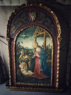 an ornate painting on display in a room