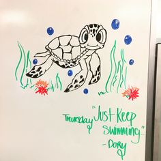 a drawing of a sea turtle on a whiteboard with writing underneath it that says, today just keep swimming day