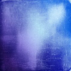 an abstract blue and purple background with scratches