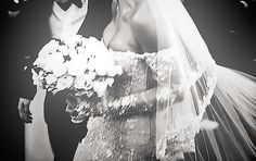 the bride and groom are walking down the aisle at their wedding ceremony in black and white