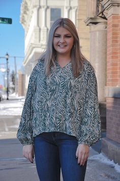 The Soft Crinkle Zebra Print Blouse is a unique blend of comfort and style. Crafted from soft crinkle gauze fabric, this top offers a lightweight and breathable feel. The zebra print adds a touch of wild charm to your outfit. The ruffle edge neckline enhances the design with a touch of femininity. With long sleeves, this top is suitable for various occasions and seasons. Whether you're aiming for a casual day out or looking to make a statement, the Soft Crinkle Zebra Print Blouse seamlessly comb Fall V-neck Blouse With Crinkle Texture, V-neck Blouse With Crinkle Texture For Fall, Green Crinkle Texture Tops For Spring, Spring Green Tops With Crinkle Texture, Green Crinkle Texture Top For Spring, Casual Crinkle Texture Tops For Fall, Casual Tops With Crinkle Texture For Fall, Casual Fall Tops With Crinkle Texture, Casual Fall Blouse With Crinkle Texture