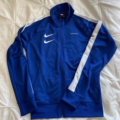 Swoosh Team Sports Jacket. Nwot-Never Worn. Size S Nike Outerwear For Sports Events In Fall, Nike Fall Outerwear For Sports Events, Nike White Track Jacket For Sports Events, Nike Functional Outerwear For Sports Events, Nike Sporty Outerwear For Sports Events, Nike Blue Track Jacket For Spring, Nike Blue Sportswear Track Jacket, Nike Blue Track Jacket Sportswear, Nike Blue Sporty Track Jacket