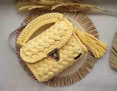 a yellow purse sitting on top of a plate