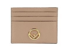 This card case wallet from Fendi is crafted from beige calfskin leather. The front face is embellished with a gold-tone F is Fendi logo. There are three card slots on each side of the card case separated by one bill slot in the center. Be bold with this stylish and convenient card case by Fendi.    Model Number: 8M0445  Card Case Wallet  Beige Calfskin Leather    Gold-tone F is Fendi Logo  Seven Card Slots  Leather Lining  Measurements: 4" x 3.15" x 0.15" (LWH)  Includes Authenticity Cards and F Luxury Gold Wallets With Logo Plaque, Designer Gold Rectangular Card Holder, Gold Leather Wallet With Logo Plaque, Designer Beige Wallet With Interior Card Slots, Designer Beige Wallet With Card Slots, Designer Beige Wallets With Interior Card Slots, Designer Beige Card Holder With Card Slots, Beige Card Holder With Card Slots For Formal Use, Luxury Gold Wallet With Rfid Blocking