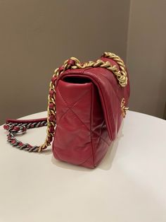 Chanel 19 Flap BagDark Red AGHWSmall 26 x 17 x 8 cmChain drop 46 cm28 Series9.5/10 Excellent (tiny dot mark at back area and minimal leather signs of use otherwise excellent)Includes box, dust bag and ity cardRTP 9160 sgd Price now 5200 sgd 3900 usd CN6020-01 Classic Red Flap Bag, Red Designer Bag With Double Flap, Red Designer Bags With Double Flap, Designer Red Double Flap Bag, Classic Red Flap Bag For Shopping, Luxury Red Flap Bag For Daily Use, Designer Red Flap Bag For Shopping, Designer Red Flap Bag For Daily Use, Designer Burgundy Rectangular Bag