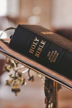 a book sitting on top of a metal stand