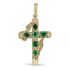 A stunning, natural deep green emerald gold cross. This remarkable piece features six, earth-mined emeralds. Gorgeous mixed shapes like emerald cut, asscher and a center set oval cut emerald. All gemstones showcase an excellent shine and vivid dark green color that never fails to enthrall. Set in a gleaming 14K yellow gold setting.  *Chain sold separately.  Setting Style: Prong Setting Material: 14K Yellow Gold Setting Weight: 5.1 Grams Main Stone: Emerald Shape: Emerald & Oval Cut Approx Weight: 1.75-Carats (Total) Clarity: Semi-Transparent Color: Vivid Green Luster: Excellent-Very Good Treatments: Natural, Oiling Origin: Zambia Estimated Retail Value: $5,490.00 USD Keep in mind we custom create all of the items listed here. If you have a special request for a custom-created item please c Emerald Shape Engagement Rings, Emerald Cross, Slider Necklace, Emerald Necklace Pendant, Emerald Style, Halo Diamond Earrings, Pear Pendant, Emerald Birthstone, Engagement Ring Shapes