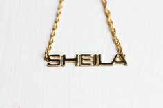 Vintage Name Necklace - Sheila Vintage Nameplate Necklaces, Vintage Gold Name Necklace, Vintage Gold Necklace With Name Detail, Vintage Custom Name Necklace For Anniversary, Vintage Gold Nameplate Jewelry, Vintage Personalized Nameplate Necklace, Personalized Vintage Nameplate Necklace, Vintage Custom Name Jewelry Nameplate, Vintage Nameplate Necklace As Gift