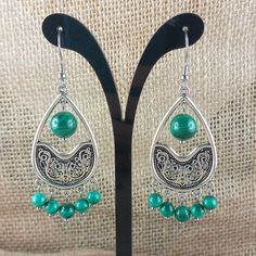 Unique model of boho style dangling earrings - arabesque with Malachite beads. Stainless steel ear hook. All earrings are handmade, in my workshop at home 😊. I do them with the heart and consciously ❤. I can also research which stone is right for you at the moment and make unique jewelry that relates to your energy. Whether you are simply sensitive to the beauty of natural stones, or a true fan of lithotherapy, you will find in my store a multiple choice of stones to wear as earrings, bracelets Green Dangle Chandelier Earrings For Festival, Bohemian Teardrop Earrings With Dangling Beads, Bohemian Green Chandelier Earrings For Festival, Handmade Green Danglers, Handmade Green Dangle Earrings, Handmade Green Drop Danglers, Green Bohemian Chandelier Earrings Nickel Free, Green Bohemian Chandelier Earrings With Dangling Beads, Bohemian Green Teardrop Earrings With Ear Wire