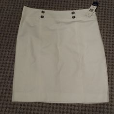 Sharp Looking, White Skirt. 4 Silver Button Accents The Waist. Side Zipper, Fully Lined. Hem Hits Right Around Knee Level. White Skirt With Button Closure For Work, White Buttoned Mini Skirt For Work, White Mini Skirt With Buttons For Work, White Mini Skirt With Button Closure For Work, White Button Closure Mini Skirt For Work, White Mini Skirt With Buttons, Fitted White Skirt With Button Closure, Chaps Skirt, White Fitted Skirt With Button Closure