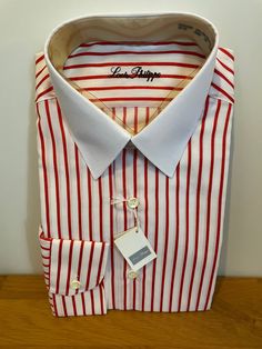 "Vintage unworn white shirt with red stripes and solid white collar in polyester cotton mix by Louis Philippe of Savile Row.  Details: point collar, long sleeves, single cuff, regular fit.  Size 15\" 38cm S/M" White Dress Shirt With Striped Collar For Work, White Cotton Dress Shirt With Striped Collar, White Shirt With Striped Collar For Work, Elegant White Shirt With Vertical Stripes, Elegant White Dress Shirt With Striped Collar, Classic Long Sleeve Dress Shirt With Vertical Stripes, Pinstripe Spread Collar Shirt For Office, Office Pinstripe Shirt With Spread Collar, Pinstripe Shirt With Spread Collar For Office