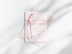 a pink and white birthday card with a ribbon on it