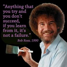 a man holding a paintbrush and smiling at the camera with a quote on it